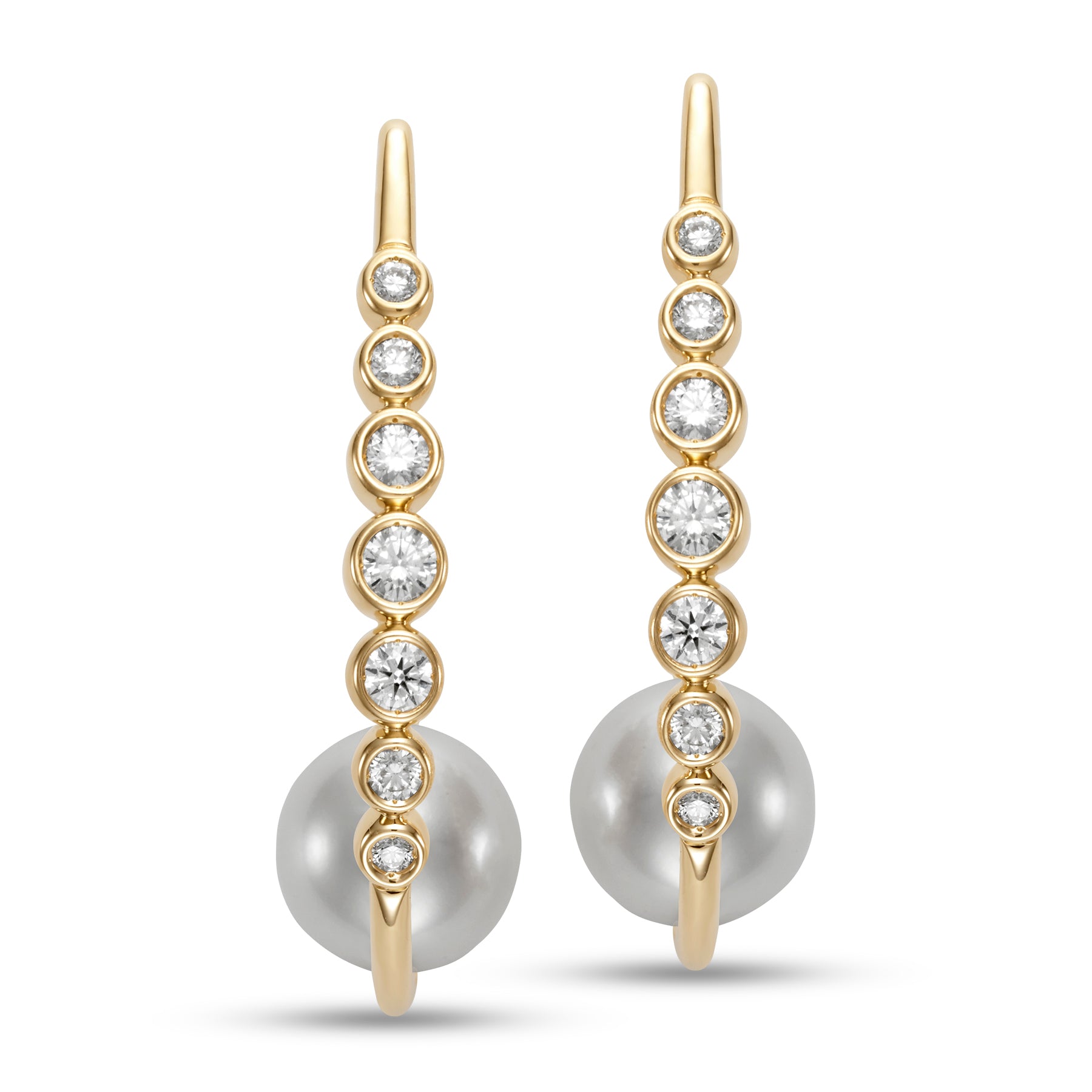 Riviera Diamond & Pearl Hoop Earings by Mastoloni available at Talisman Collection Fine Jewelers in El Dorado Hills, CA and online. Embrace your inner grace with the breathtaking Riviera Hoop Earrings. A decadent combination of 10.5-11mm freshwater pearls and .75 carats of sparkling white diamonds, set in 18k yellow gold. A true masterpiece of art and craftsmanship, designed for those who appreciate timeless elegance and the finest things in life.