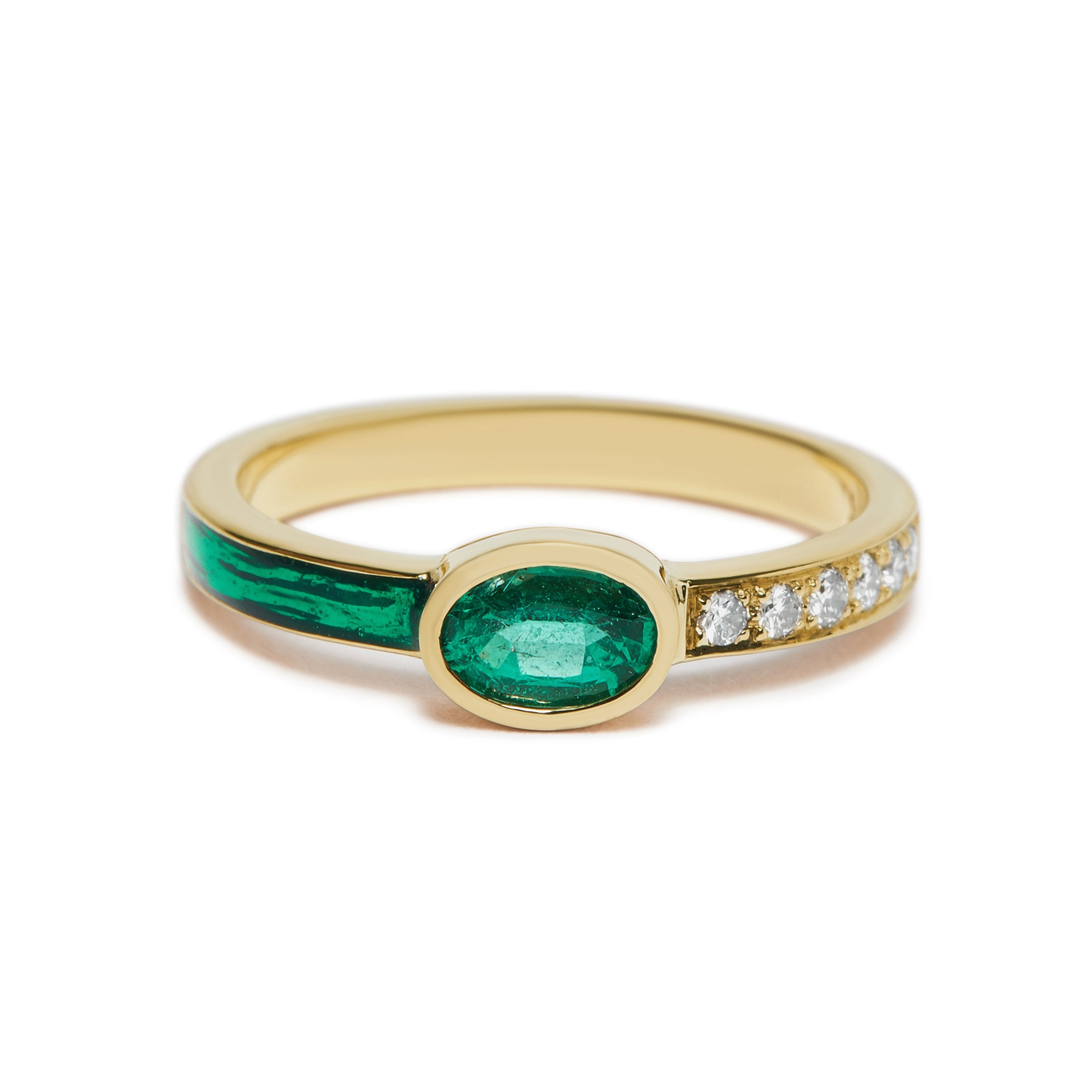 Emerald Tea Party Ring by Unhada available at Talisman Collection Fine Jewelers in El Dorado Hills, CA and online. The Emerald Tea Party Ring is a whimsical blend of elegance and playfulness. Featuring a vibrant .37 ct emerald framed by sparkling diamonds (.06 cts) and rich green enamel, this ring is crafted in 18k gold for a refined finish. Its feminine design and lively color palette make it a standout piece, perfect for adding a pop of color and personality to any look. Available in size 8.