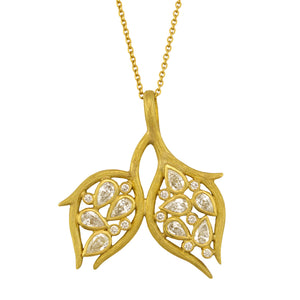 Double Leaf and Vine Pendant Necklace by Laurie Kaiser available at Talisman Collection Fine Jewelers in El Dorado Hills, CA and online.The Double Leaf and Vine Pendant Necklace embodies the beauty of nature. The pendant is embellished with glistening pear-cut diamonds totaling .90 carats and .10cts of white round brilliant diamonds all set in 18k yellow gold subtly textured vines. The 20-inch chain makes it a perfect choice for layering, or worn alone, it highlights your décolletage.