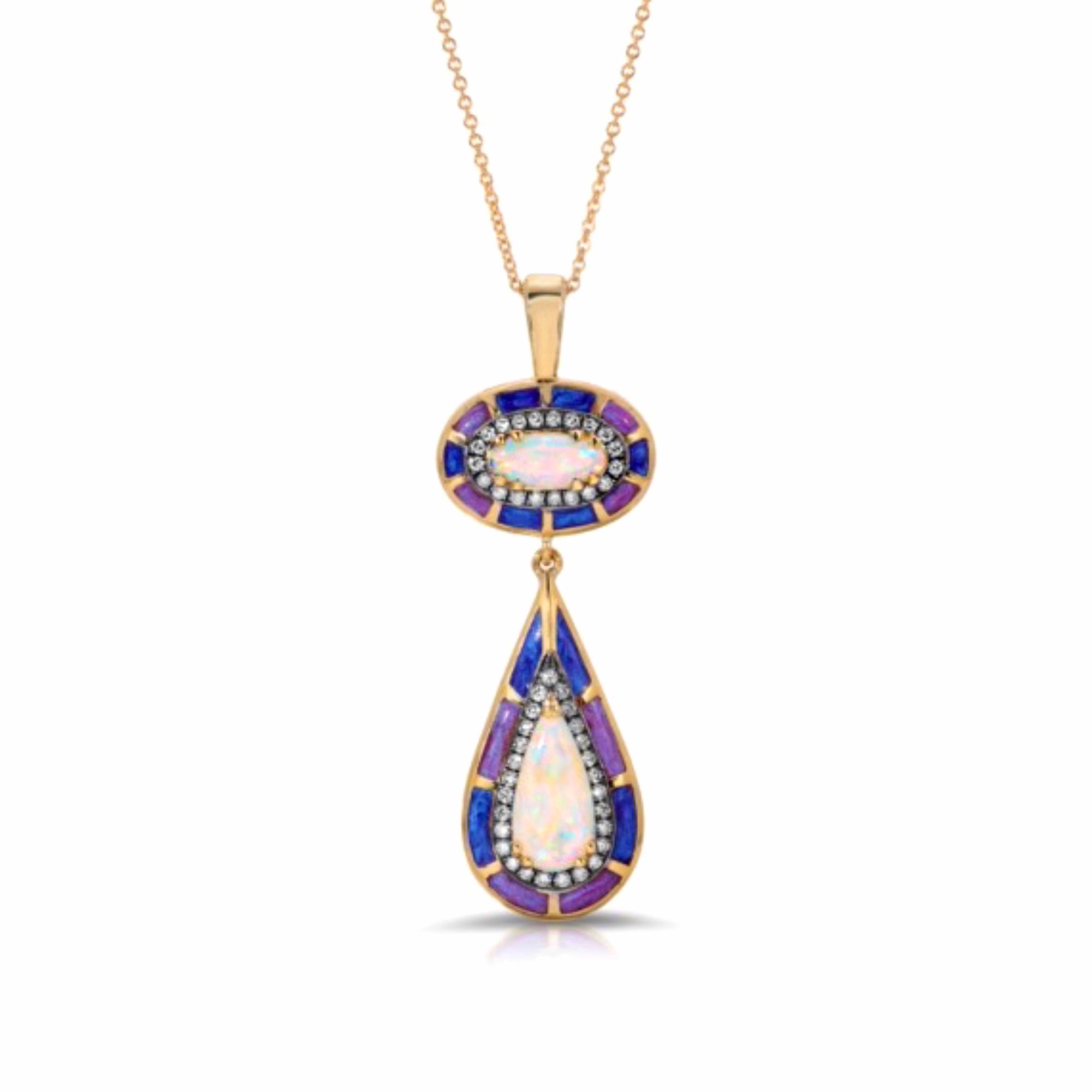 Opal Drop Enamel Pendant Necklace by Lord Jewelry available at Talisman Collection Fine Jewelers in El Dorado Hills, CA and online. Experience the magic of opals combined with exquisite craftsmanship. This double opal drop pendant necklace features 1.29 cts of stunning cabochon opals, artistically surrounded by vibrant blue and purple enamel. The opals are accentuated by 0.34 carats of diamonds, all set in 18K yellow gold. Be prepared to receive compliments wherever you go.