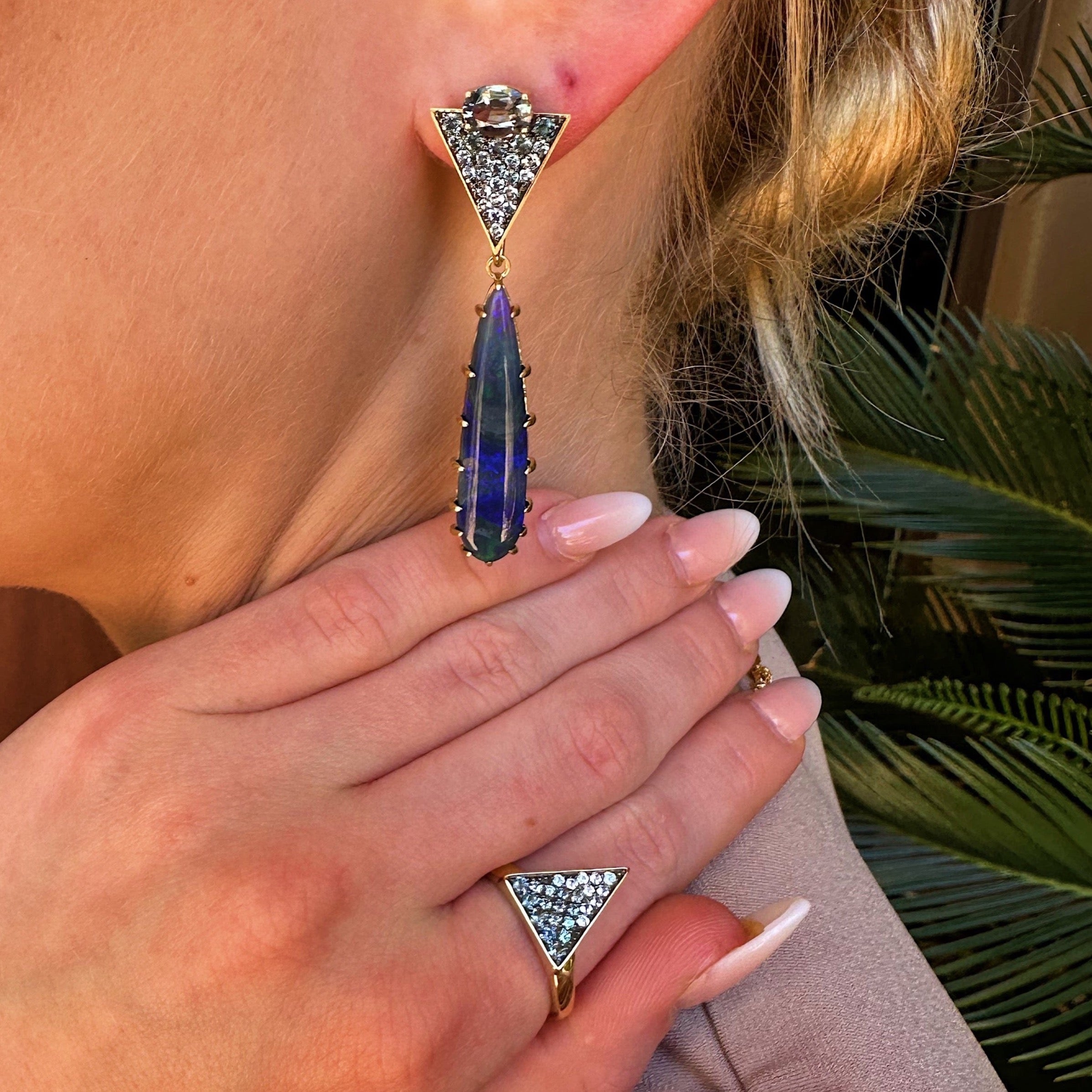 Orion's Pave Triangle Ring by Meredith Young available at Talisman Collection Fine Jewelers in El Dorado Hills, CA and online. Like constellations in the night sky, Orion's Pave Triangle Ring beckons with its enchanting .2 carat denim blue spinels and a dynamic .3 carat color-change garnets. Fashioned from 18K yellow gold, this ring offers a modern twist on celestial beauty.