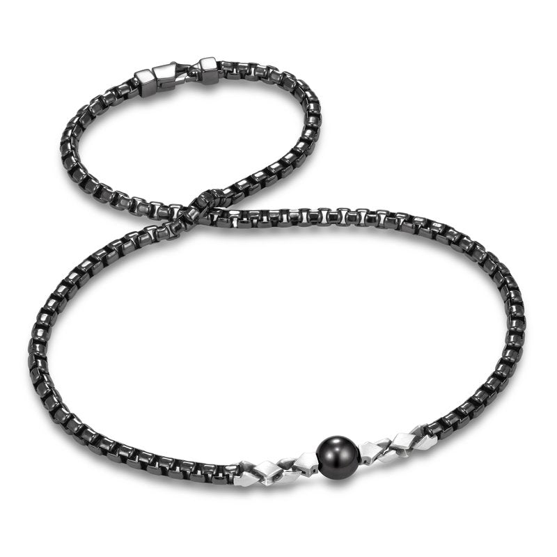 Sorrento Tahitian Pearl Men's Necklace by Mastoloni Pearls available at Talisman Collection Fine Jewelers in El Dorado Hills, CA and online. The Mastoloni Sorrento Tahitian Pearl Necklace showcases a sizable 11-12 mm pearl and is meticulously crafted from blackened sterling silver. With a length of 22", it offers effortless wearability and adds a touch of boldness to this timeless piece.