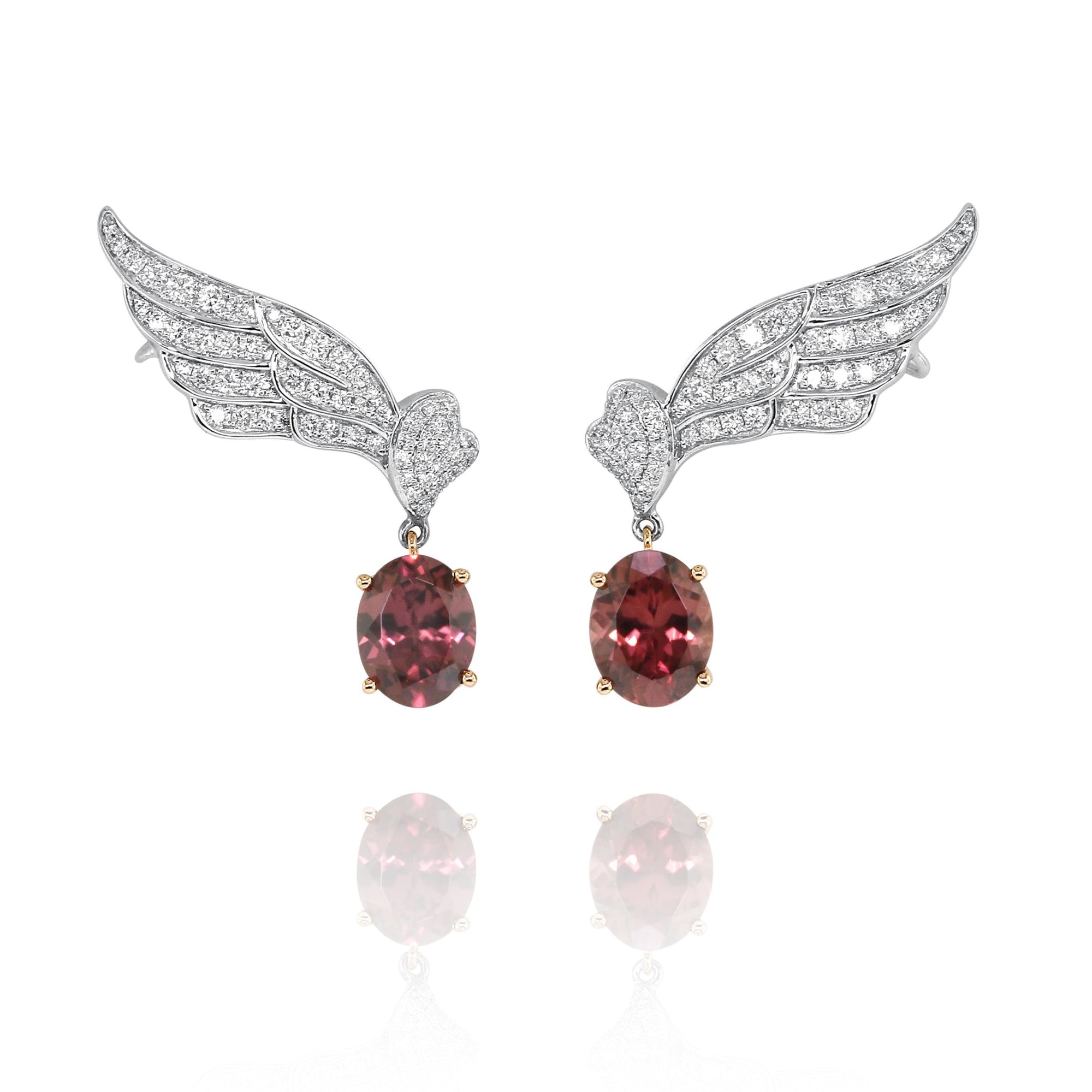 Garnet & Diamond Wing Earrings by Yael available at Talisman Collection Fine Jewelers in El Dorado Hills, CA and online. Dramatic and bold, these garnet and diamond wing earrings feature 5.92 cts of oval garnets set in 18k rose gold, dangling from wings encrusted with 0.91cts of sparkling round brilliant diamonds, set in 18k white gold. A classic motif with an edgy update, these earrings will make a fabulous addition to your jewelry wardrobe.