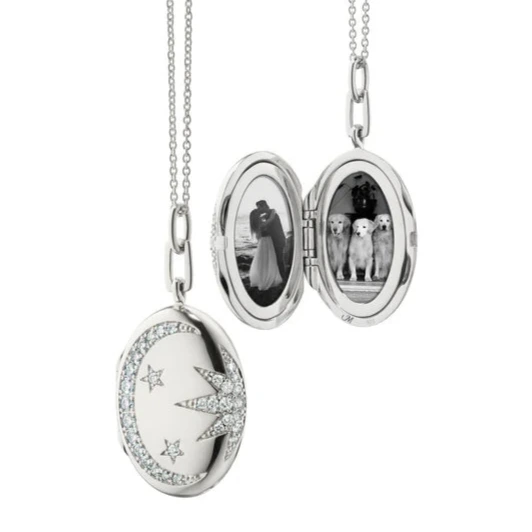 Galaxy Locket with White Sapphires by Monica Rich Kosann by Monica Rich Kosann available at Talisman Collection Fine Jewelers in El Dorado Hills, CA and online. Our Galaxy Locket captures the beauty of the cosmos with white sapphire accents forming a sun, moon, and stars. Designed to hold two images, this locket is finished with rhodium for lasting shine and tarnish protection. Measuring 1 1/16" tall and 13/16" wide, it’s strung on a 22" cable chain with an additional loop at 20" for adjustability. A perfec
