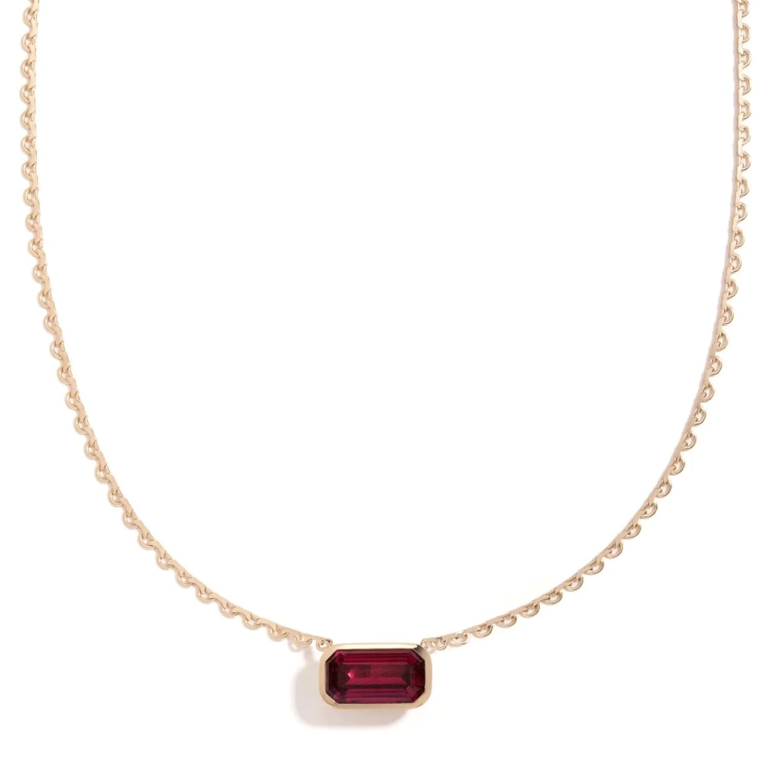 Rhodolite Lace Pendant by Mined + Found available at Talisman Collection Fine Jewelers in El Dorado Hills, CA and online. This one-of-a-kind, 8.35 ct emerald cut rhodolite garnet, mined and cut in Voi, Kenya, rests in a pillowy bezel setting on a lace link chain; the spectacular gem reverses to a luminous 14k gold satin finish, complete with engraved starburst & a 0.005 ct sparkling diamond at its heart. With a total length of 18", this show stopper is a singular beauty. 