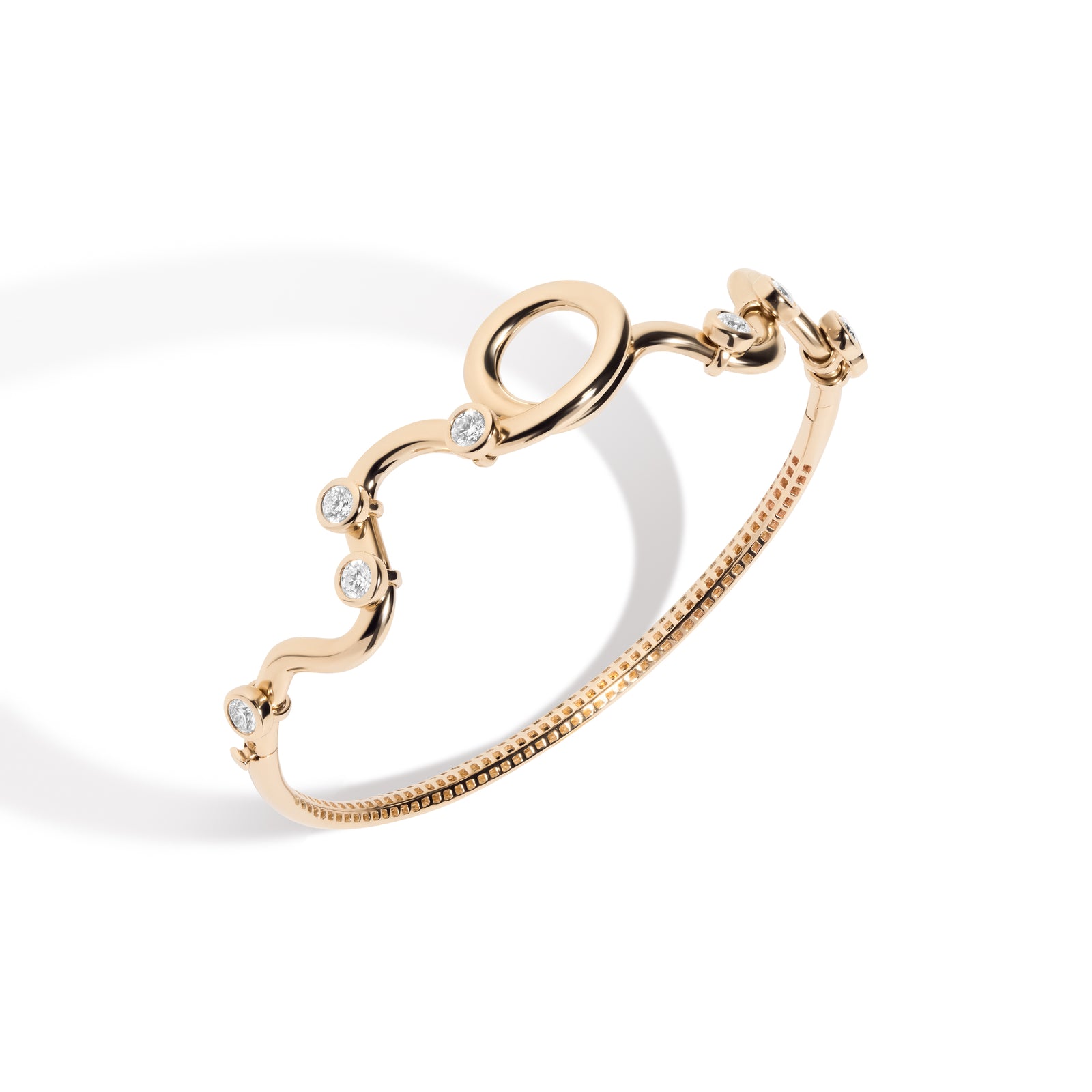 Rollercoaster Bangle Bracelet by Mined + Found available at Talisman Collection Fine Jewelers in El Dorado Hills, CA and online.  Experience the ride of life with the 14k yellow gold rollercoaster bangle! Featuring 0.80 cts of moveable diamonds that glide along a twisting and winding pathway, this bracelet is a whimsical journey from one side to the other. The inner gallery is designed with a rollercoaster track inspired pattern, adding a touch of playful flair. Keep the fun going with the easy side hinge a