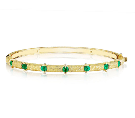 Emerald Antique Amulet Station Bangle by Penny Preville available at Talisman Collection Fine Jewelers in El Dorado Hills, CA and online. A true stunner!&nbsp;The Emerald Antique Amulet Round Station Bangle features 0.71 carats of round emeralds set in stunning textured 18K gold. Wear this unique bangle on it's own or stack with more bracelets for a bold look.