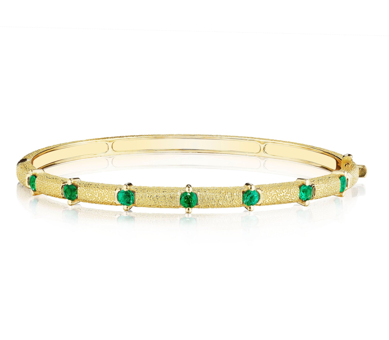 Emerald Antique Amulet Station Bangle by Penny Preville available at Talisman Collection Fine Jewelers in El Dorado Hills, CA and online. A true stunner!&nbsp;The Emerald Antique Amulet Round Station Bangle features 0.71 carats of round emeralds set in stunning textured 18K gold. Wear this unique bangle on it's own or stack with more bracelets for a bold look.