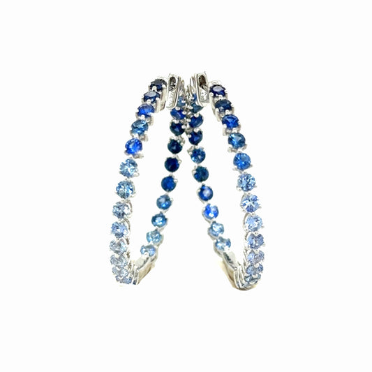 Ombre Blue Sapphire & 18k White Gold Hoop Earrings by Lisa Nik available at Talisman Collection Fine Jewelers in El Dorado Hills, CA and online. The serene beauty of these ombre blue sapphire earrings will bring you a sense of peace. Graced with 2.94 cts of sapphires and set in 18k white gold, these hinged hoops are a modern classic. Lisa Nik's gemstones are earth-mined, natural, and untreated, showcasing their unique and untouched beauty.