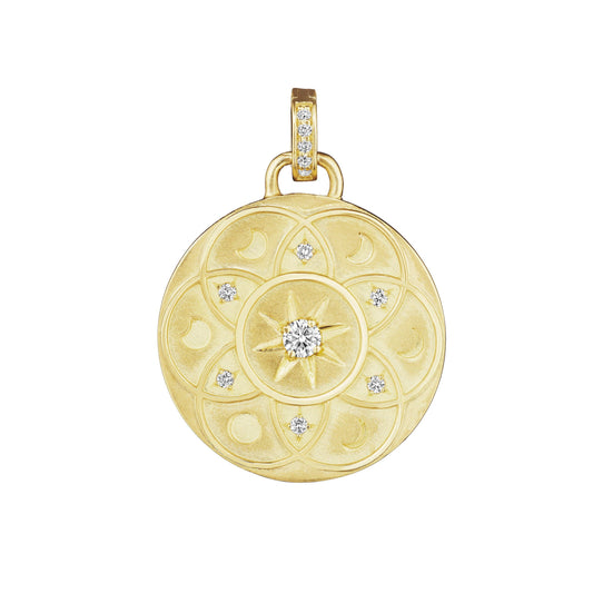 Lunar Medallion Charm by Penny Preville available at Talisman Collection Fine Jewelers in El Dorado Hills, CA and online. Unveil your inner enchantress with the 18k Lunar Medallion, a piece that captures the magic of the cosmos. Adorned with .20 cts of shimmering diamonds, this charm brings a touch of the heavens to your jewelry collection. Crafted in luminous 18k gold, its intricate design evokes a sense of wonder and mystery, perfect for those who are drawn to the beauty of the night sky.