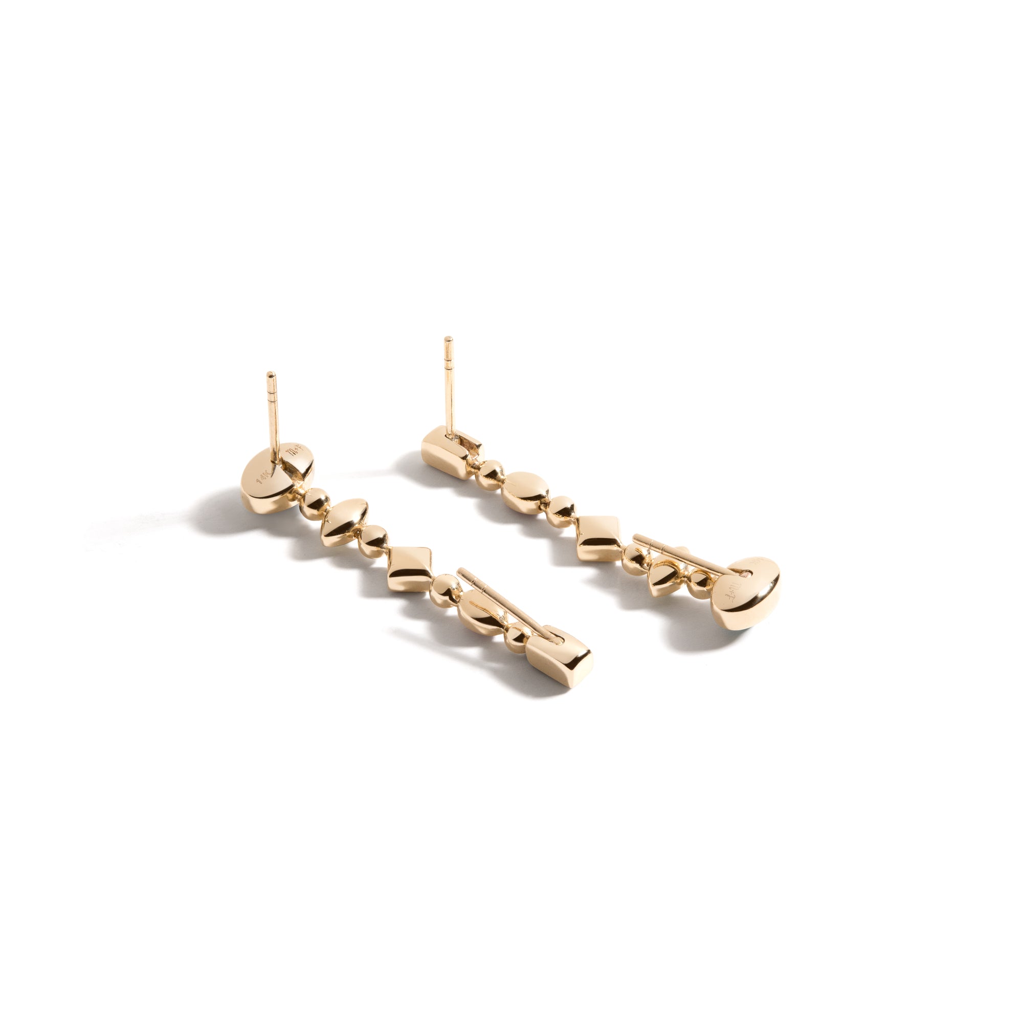 Confetti Reverse Earrings by Mined + Found available at Talisman Collection Fine Jewelers in El Dorado Hills, CA and online. These festive earrings features a cool ombré gradient of  of brilliant gems including: tsavorite garnet, amethyst and blue topaz paired with moonstone, rich with blue flashes of adularescence, totaling 2.22 cts combined. The handmade 14k yellow gold settings are accented with 0.17cts of sparkling diamonds. And the Confetti Convertible earrings hold a secret: a hinged post at each end 