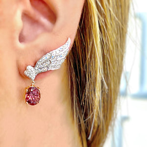 Garnet & Diamond Wing Earrings by Yael available at Talisman Collection Fine Jewelers in El Dorado Hills, CA and online. Dramatic and bold, these garnet and diamond wing earrings feature 5.92 cts of oval garnets set in 18k rose gold, dangling from wings encrusted with 0.91cts of sparkling round brilliant diamonds, set in 18k white gold. A classic motif with an edgy update, these earrings will make a fabulous addition to your jewelry wardrobe.