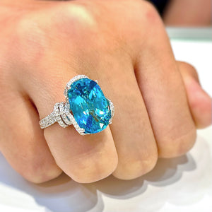 Blue Zircon & Diamond Ring by Yael available at Talisman Collection Fine Jewelers in El Dorado Hills, CA and online. This magnificent cocktail ring features an impressive 12.45 carat blue zircon surrounded by 0.85 carats of sparkling white diamonds set in 18k white gold. Both modern and classic, it's sure to be a future heirloom.