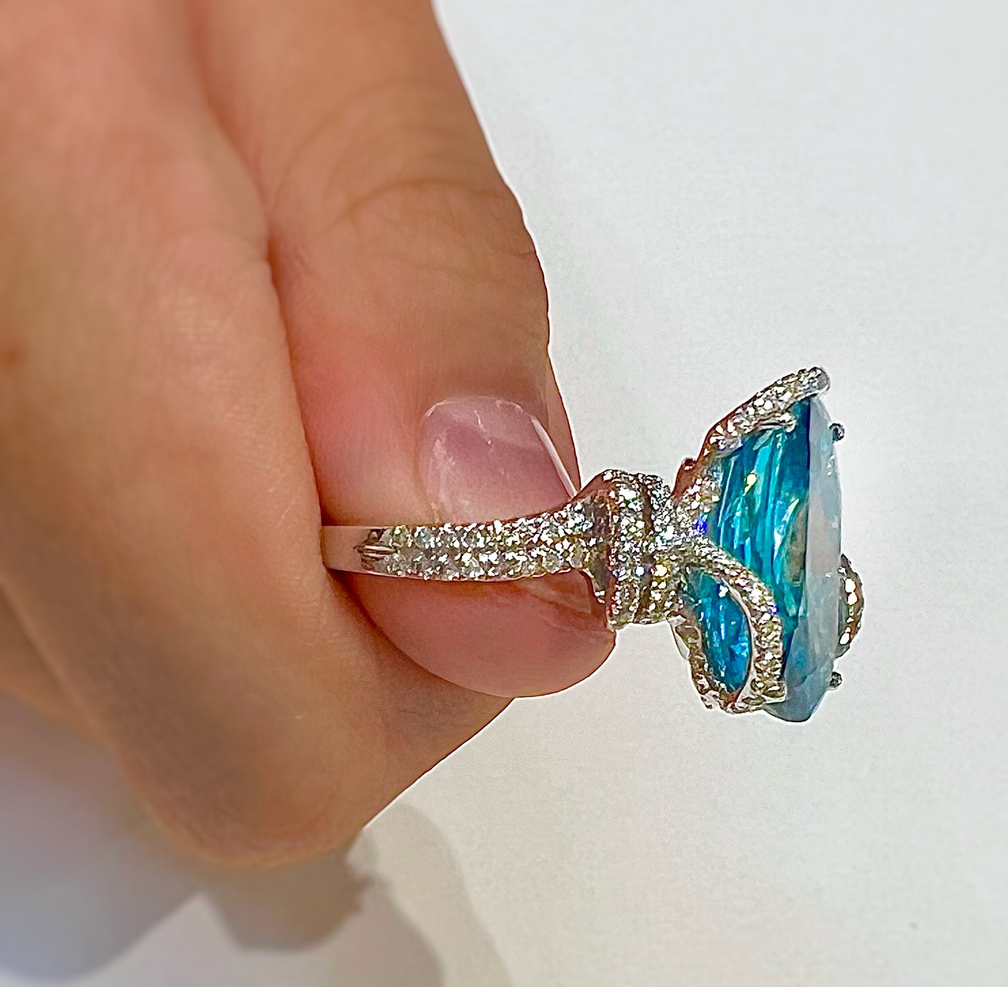 Blue Zircon & Diamond Ring by Yael available at Talisman Collection Fine Jewelers in El Dorado Hills, CA and online. This magnificent cocktail ring features an impressive 12.45 carat blue zircon surrounded by 0.85 carats of sparkling white diamonds set in 18k white gold. Both modern and classic, it's sure to be a future heirloom.