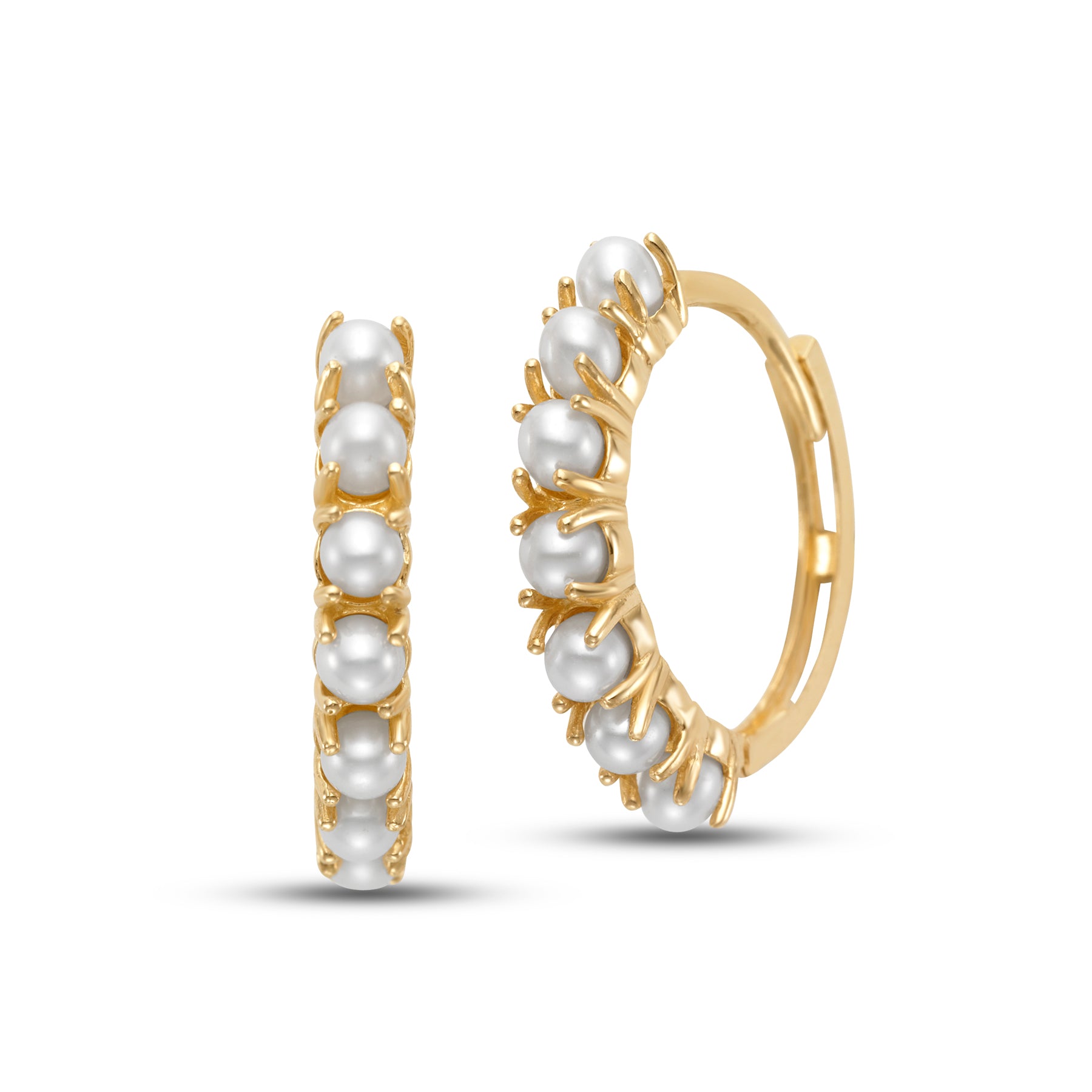 Freshwater Pearl Hoop Earrings by Mastoloni available at Talisman Collection Fine Jewelers in El Dorado Hills, CA and online. Dainty and classic, these small 14k yellow gold hoops are encircled by a row of 3mm prong-set freshwater pearls. The pearls add a soft glow that contrasts the gold, creating a delicate balance of texture and shine. Lightweight and versatile, these hoops are perfect for adding a touch of charm to both casual and dressed-up looks.