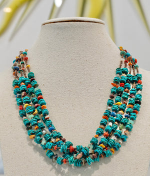 Native American 5 Strand Turquoise Nugget Necklace available at Talisman Collection Fine Jewelers in El Dorado Hills, CA and online.This exquisite 5 strand 20” necklace is an authentic Native American piece. It features beautiful and natural flat Tibetan turquoise nuggets, along with Tibetan turquoise cones, baby chocolate olivela heishi shells, lapis, freshwater pearl, coral, mother of pearl shell, adventurine, abalone shell, and chrysocolla.
