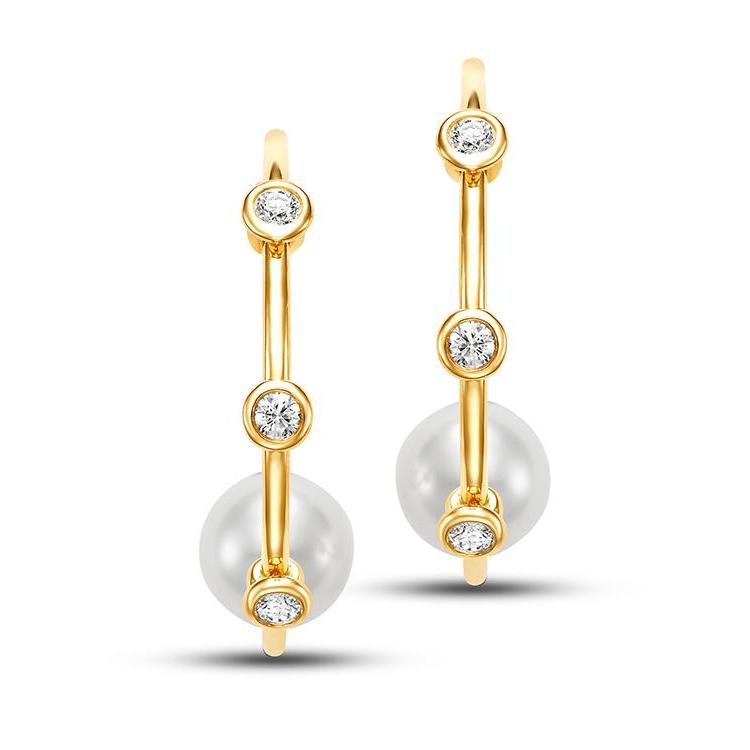 Freshwater Pearl and Diamond Hoop Earrings by Mastoloni available at Talisman Collection Fine Jewelers in El Dorado Hills, CA and online.These Freshwater Pearl and Diamond Hoop Earrings offer a blend of classic and modern style. Featuring 10 - 10.5 mm white freshwater pearls, the hoops are highlighted by bezel-set diamond stations totaling 0.50 cts. Designed in 18k yellow gold, they provide a refined look that transitions easily from day to night. 