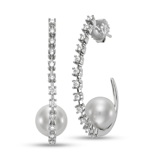Pearl & Diamond Hoop Earrings by Mastoloni Pearls available at Talisman Collection Fine Jewelers in El Dorado Hills, CA and online. Crafted with precision and elegance, these 18k white gold hoop earrings feature a dazzling .75 carats of diamonds and timeless 10 - 10.5 mm freshwater pearls. Each element is meticulously chosen to create an elegant and timeless piece of jewelry that is sure to be loved for eternity. 