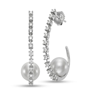 Pearl & Diamond Hoop Earrings by Mastoloni Pearls available at Talisman Collection Fine Jewelers in El Dorado Hills, CA and online. Crafted with precision and elegance, these 18k white gold hoop earrings feature a dazzling .75 carats of diamonds and timeless 10 - 10.5 mm freshwater pearls. Each element is meticulously chosen to create an elegant and timeless piece of jewelry that is sure to be loved for eternity. 