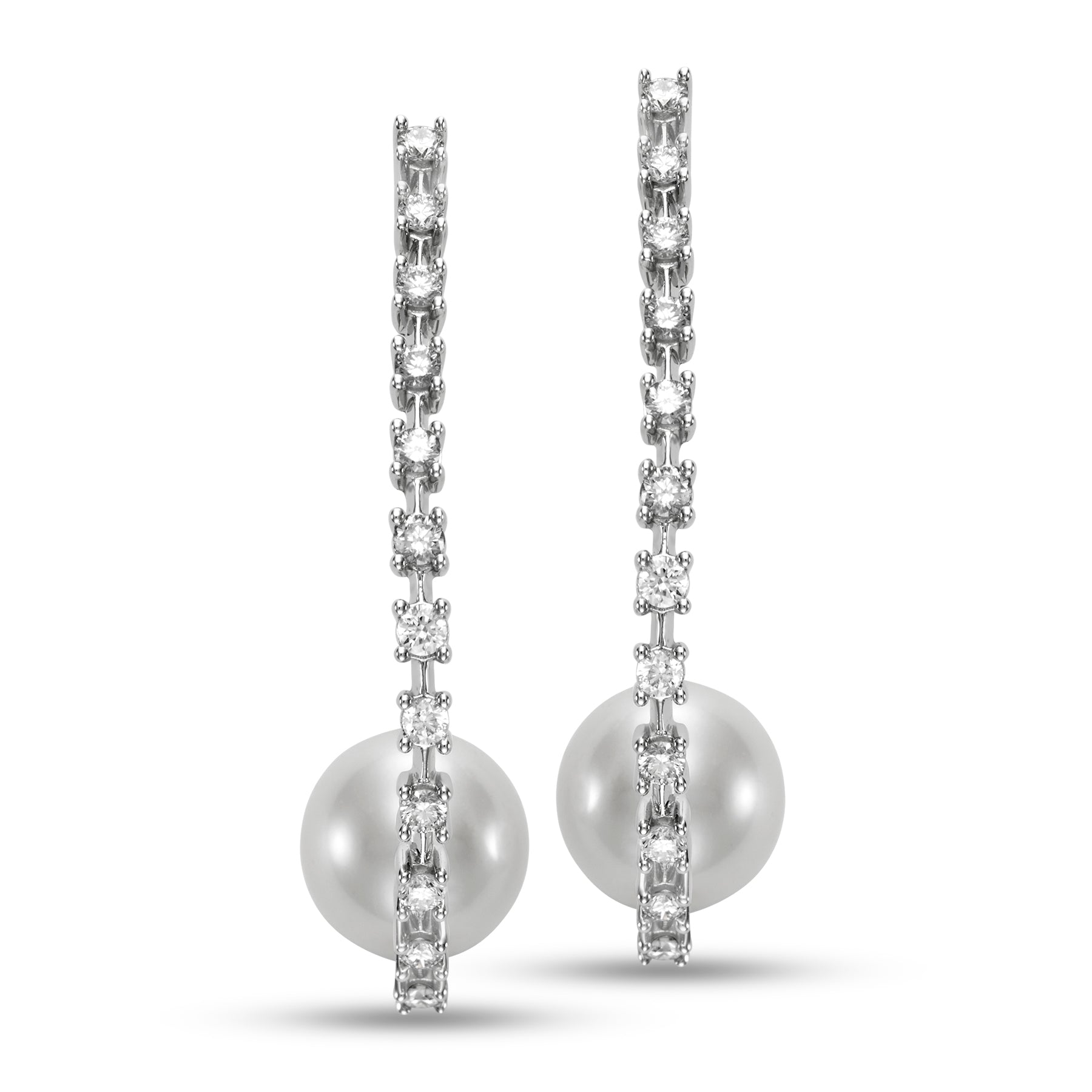 Pearl & Diamond Hoop Earrings by Mastoloni Pearls available at Talisman Collection Fine Jewelers in El Dorado Hills, CA and online. Crafted with precision and elegance, these 18k white gold hoop earrings feature a dazzling .75 carats of diamonds and timeless 10 - 10.5 mm freshwater pearls. Each element is meticulously chosen to create an elegant and timeless piece of jewelry that is sure to be loved for eternity. 