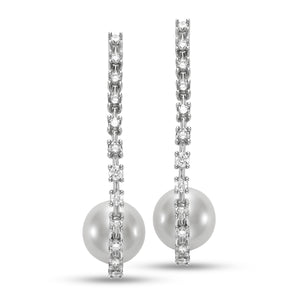 Pearl & Diamond Hoop Earrings by Mastoloni Pearls available at Talisman Collection Fine Jewelers in El Dorado Hills, CA and online. Crafted with precision and elegance, these 18k white gold hoop earrings feature a dazzling .75 carats of diamonds and timeless 10 - 10.5 mm freshwater pearls. Each element is meticulously chosen to create an elegant and timeless piece of jewelry that is sure to be loved for eternity. 