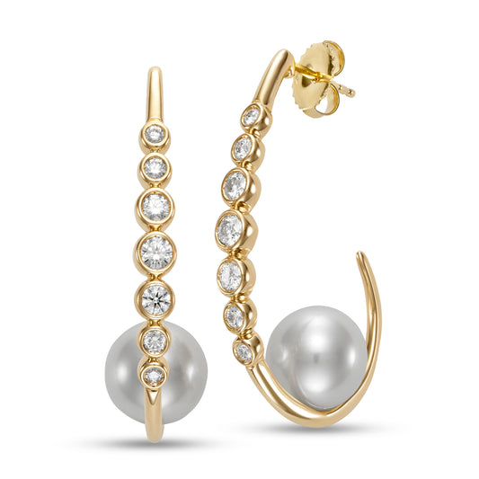 Riviera Diamond & Pearl Hoop Earings by Mastoloni available at Talisman Collection Fine Jewelers in El Dorado Hills, CA and online. Embrace your inner grace with the breathtaking Riviera Hoop Earrings. A decadent combination of 10.5-11mm freshwater pearls and .75 carats of sparkling white diamonds, set in 18k yellow gold. A true masterpiece of art and craftsmanship, designed for those who appreciate timeless elegance and the finest things in life.