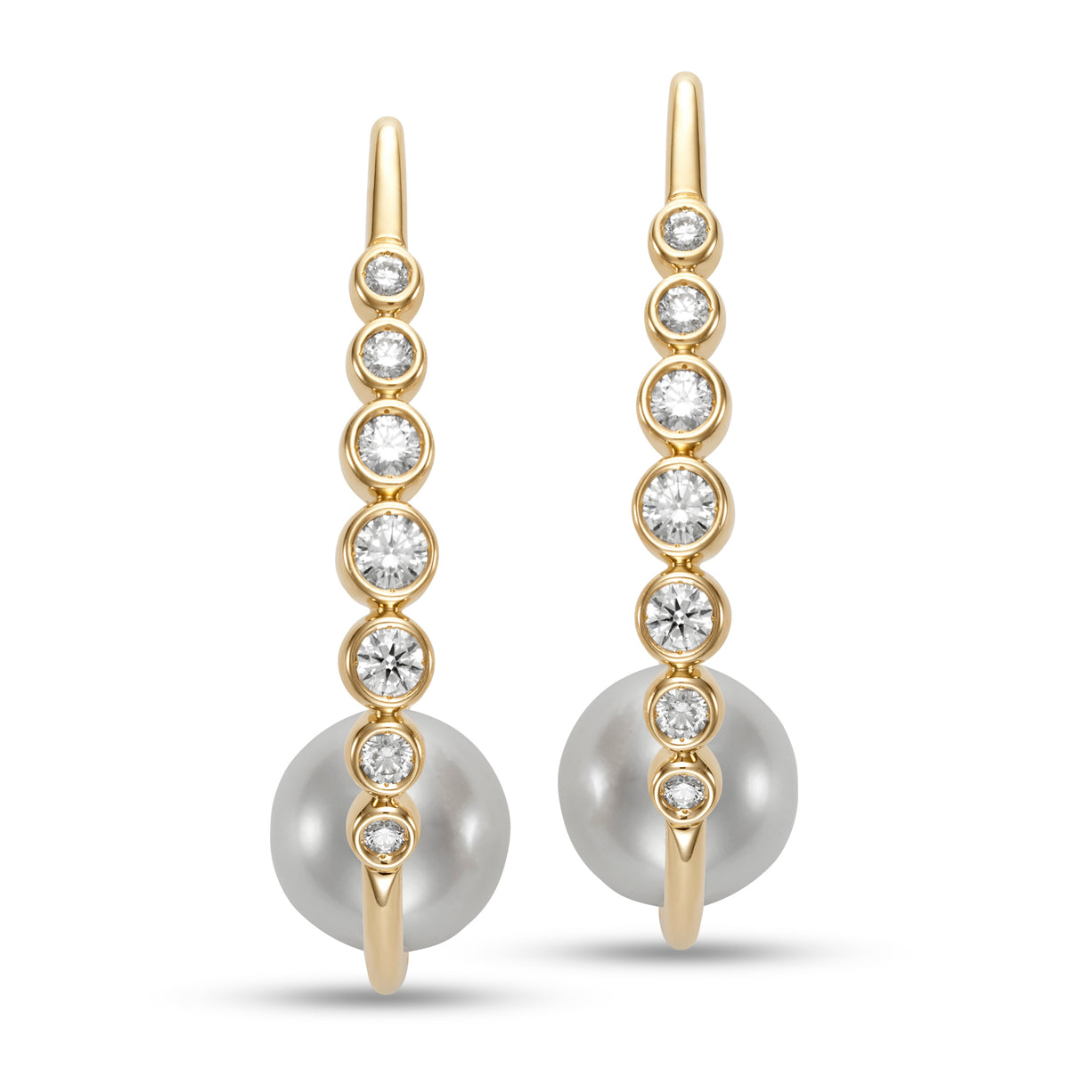 Riviera Diamond & Pearl Hoop Earings by Mastoloni available at Talisman Collection Fine Jewelers in El Dorado Hills, CA and online. Embrace your inner grace with the breathtaking Riviera Hoop Earrings. A decadent combination of 10.5-11mm freshwater pearls and .75 carats of sparkling white diamonds, set in 18k yellow gold. A true masterpiece of art and craftsmanship, designed for those who appreciate timeless elegance and the finest things in life.