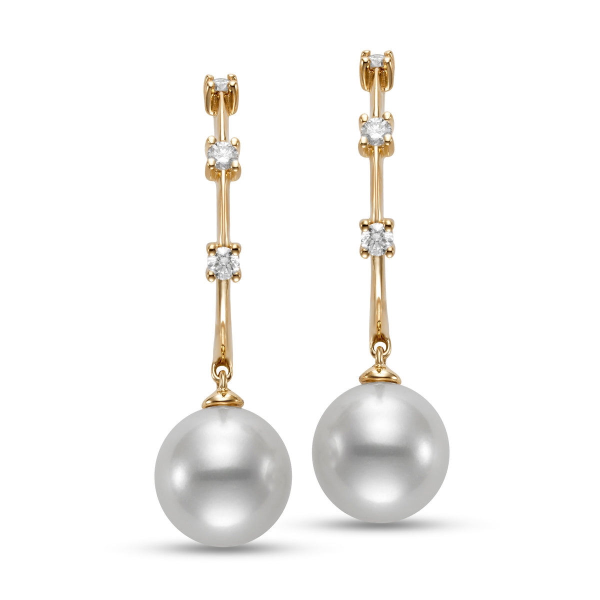 Tre Diamond & Pearl Hoop Earrings by Mastoloni available at Talisman Collection Fine Jewelers in El Dorado Hills, CA and online. Experience true luxury with the Tre Diamond & Pearl Hoop Earrings by Mastoloni. Crafted with 18K yellow gold, these hoops feature three dazzling diamonds totaling .20 cts and stunning 9-9.5mm freshwater pearls. A design that will never fade, these earrings are a must-have for those who value style and sophistication.