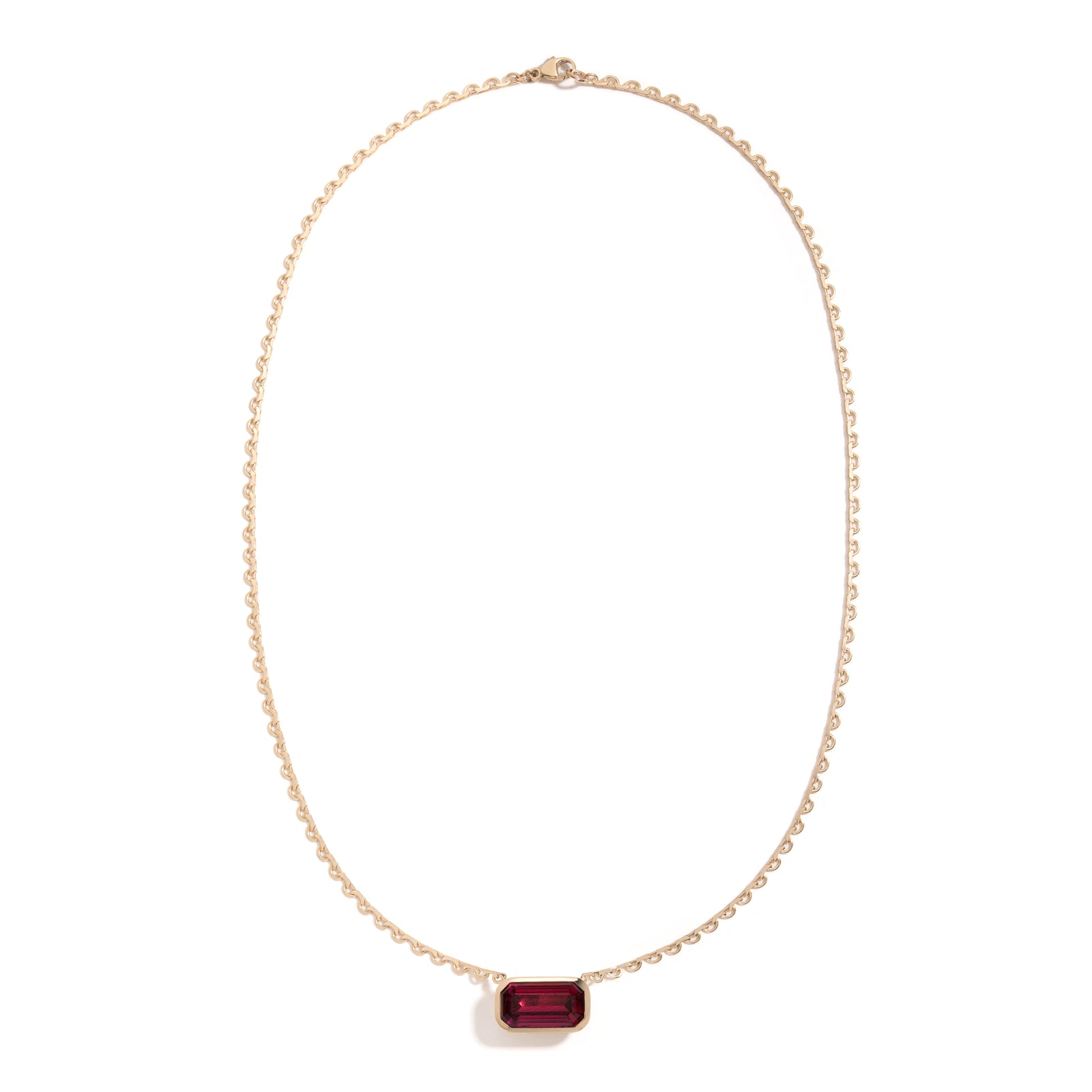 Rhodolite Lace Pendant by Mined + Found available at Talisman Collection Fine Jewelers in El Dorado Hills, CA and online. This one-of-a-kind, 8.35 ct emerald cut rhodolite garnet, mined and cut in Voi, Kenya, rests in a pillowy bezel setting on a lace link chain; the spectacular gem reverses to a luminous 14k gold satin finish, complete with engraved starburst & a 0.005 ct sparkling diamond at its heart. With a total length of 18", this show stopper is a singular beauty. 