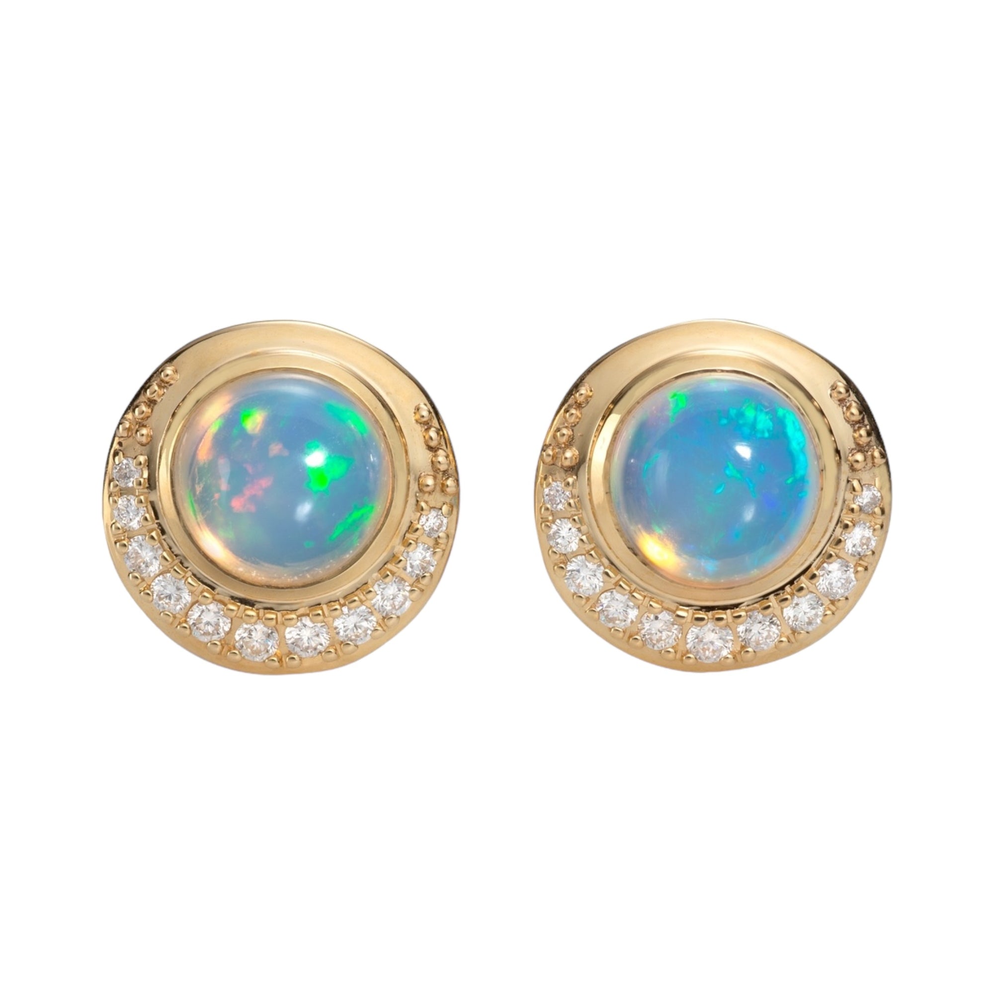 Blue Hour Button Earrings by Martha Seely available at Talisman Collection Fine Jewelers in El Dorado Hills, CA and online. Transform your look with these stunning Blue Hour Button Earrings. Crafted with 8mm Welo Opals and 0.276 carats of sparkling diamonds set in 14k gold, these earrings add a touch of sophistication and luxury, making them the for any occasion.