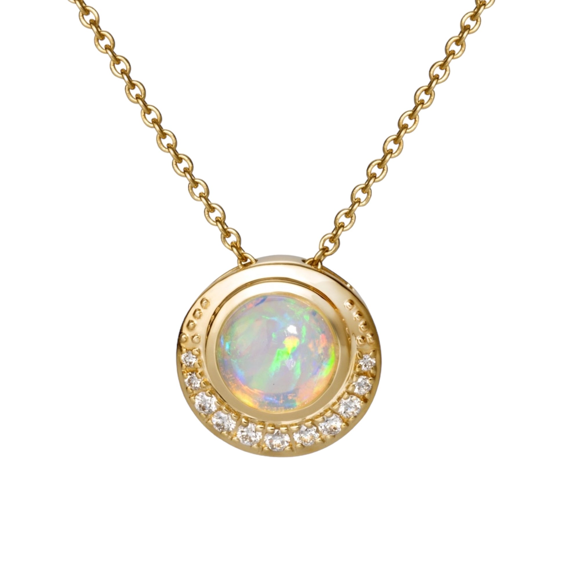 Blue Hour Single Pendant by Martha Seely Blue Hour Single Pendant by Martha Seely Stats: With it's flashing colors, the almost mystical opal pendant will make you feel like summer on a winter day. The Welo opal is 8mm round and is surrounded by 11 diamonds (0.1605t cw). The little 18k yellow gold button pendant hangs from an 18” cable chain with a lobster clasp. Feel at one with the universe as you wear this mystical cosmic pendant.