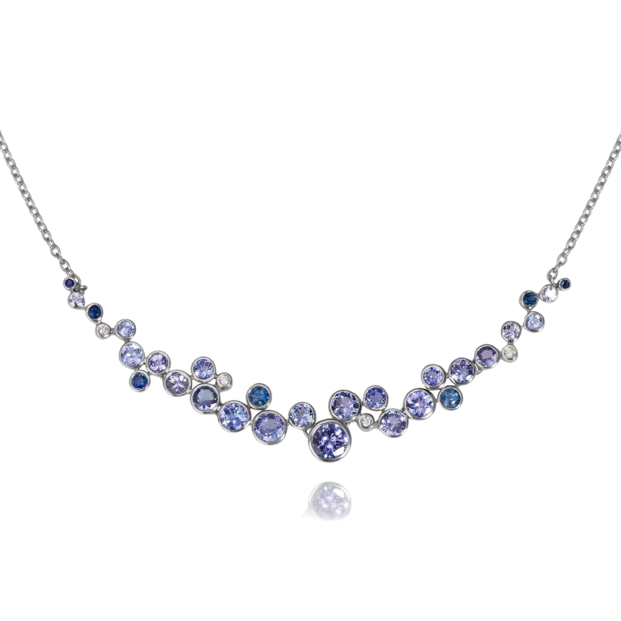 Constellation Blue Ombre Necklace by Martha Seely available at Talisman Collection Fine Jewelers in El Dorado Hills, CA and online. Stats: Your trip to the blue constellation continues with this graceful and elegant blue ombre necklace in 14k gold. With 6.6 cts of sapphires and tanzanites and 0.042 cts of diamonds it will surely dazzle. The cluster is suspended from a delicate 18” cable chain with a lobster clasp.
