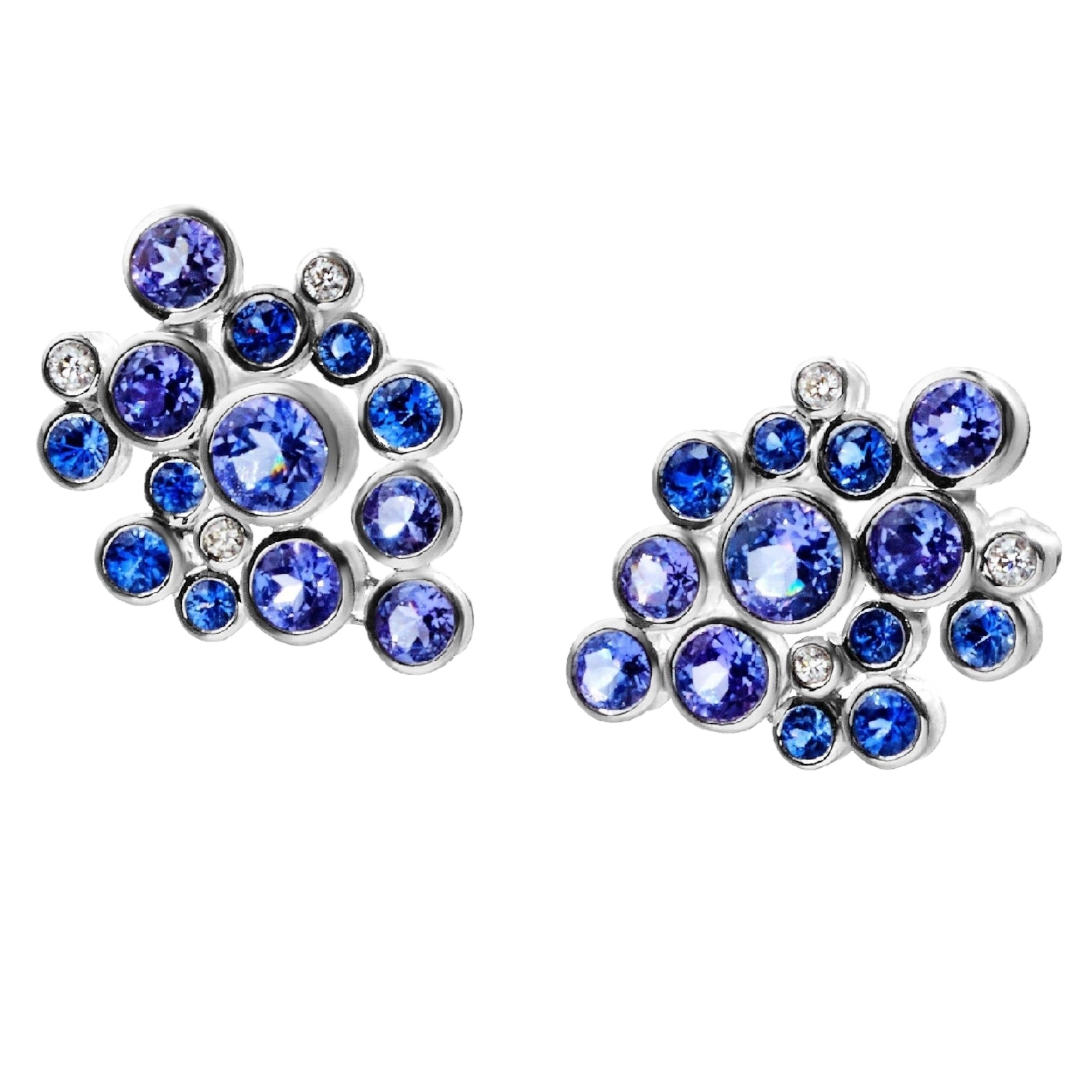 Constellation Cluster Blue Ombre Earrings by Martha Seely available at Talisman Collection Fine Jewelers in El Dorado Hills, CA and online. Stats: Diamonds, sapphires, and tanzanites, oh my! These constellation inspired earrings are comprised of 0.92 cts of sapphires, 2.20 cts of tanzanites and 0.1 cts of diamonds, all bezel set and glittering like stars in the sky. Post style earrings in 14k gold. Measure .75" x .5” w. 