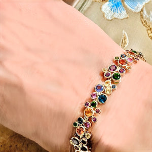 Milkyway Bracelet by Martha Seely available at Talisman Collection Fine Jewelers in El Dorado Hills, CA and online. Stats: Here is a bracelet designed make you happy! 14.53 cts of sparkling multi-color gems including blue topaz, citrine, pink and green tourmaline, amethyst, iolite, spessartite, yellow sapphires, pink garnets, and 0.070 cts of diamonds adorn this unique tennis-style bracelet.