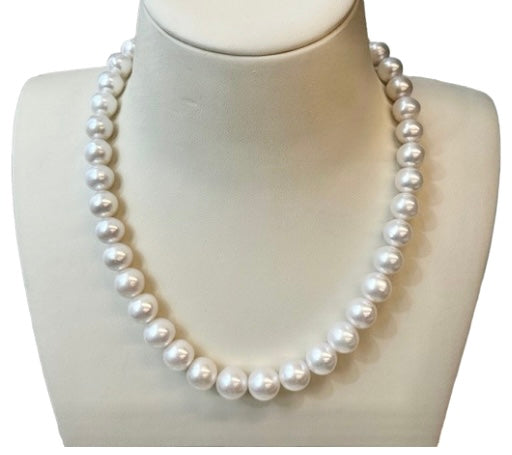 White Pearl Necklace by Mastoloni available at Talisman Collection Fine Jewelers in El Dorado Hills, CA and online. Masterfully crafted with 11-14 mm freshwater pearls, this strand of white pearls from Mastoloni is nothing short of iconic. Handpicked for their extraordinary luster and exceptional quality, these pearls are strung at a flattering 16.5" length , making it a timeless investment to wear again and again, a true treasure to be cherished forever.