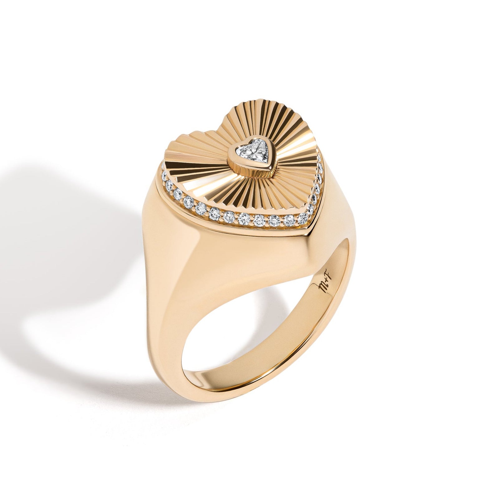 Sweet Life Ring by Mined + Found available at Talisman Collection Fine Jewelers in El Dorado Hills, CA and online. Life. Though, sometimes hard and unmalleable, always holds sweet surprises at the heart of it all - if only one is willing to look. The top of the 14k gold ring, features a heart shape diamond in the center of sunburst-texturing, surrounded by pavé diamonds around the perimeter, totaling 0.30 cts. The top ot the heart swivels open to reveal a hidden compartment holding one very sweet surprise: 