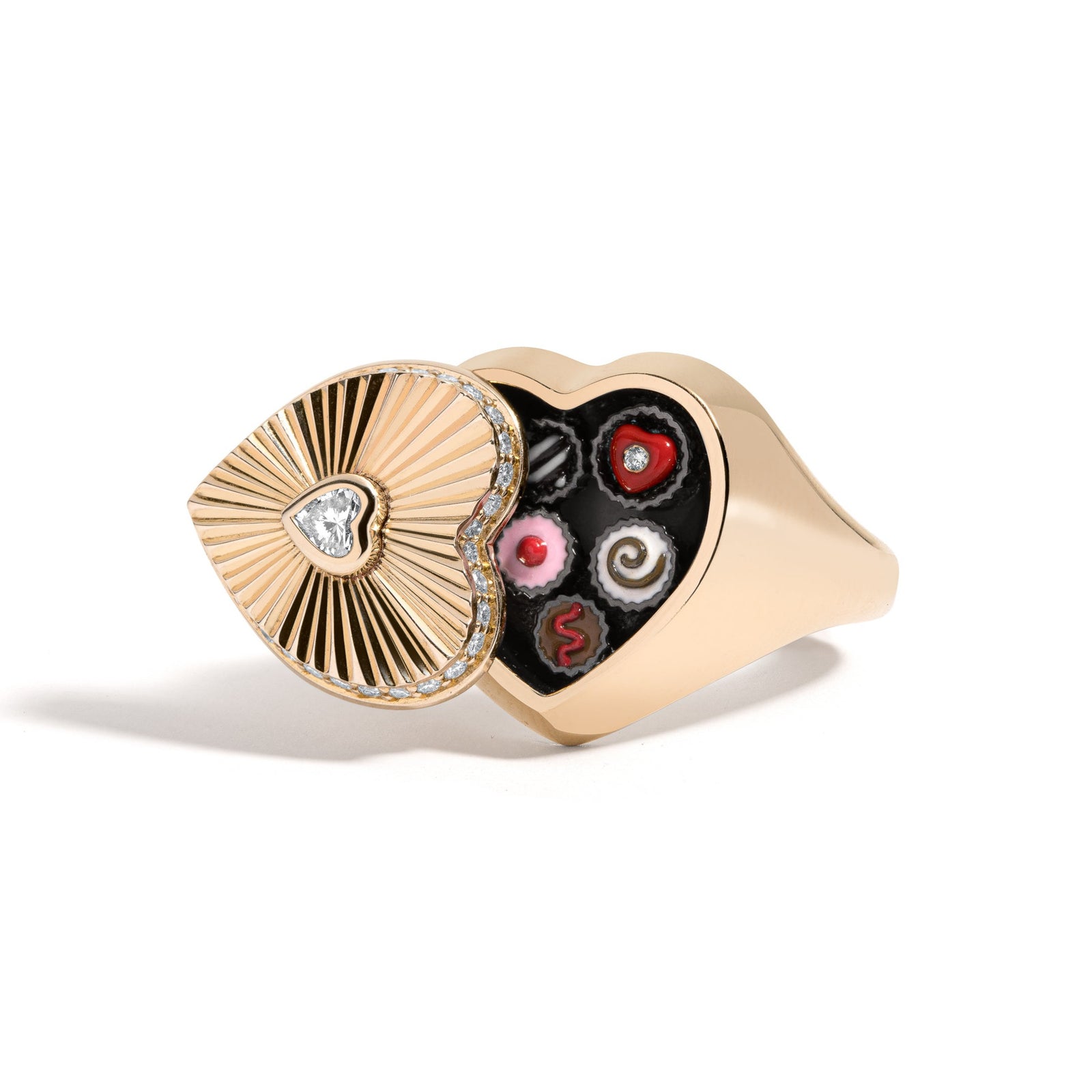 Sweet Life Ring by Mined + Found available at Talisman Collection Fine Jewelers in El Dorado Hills, CA and online. Life. Though, sometimes hard and unmalleable, always holds sweet surprises at the heart of it all - if only one is willing to look. The top of the 14k gold ring, features a heart shape diamond in the center of sunburst-texturing, surrounded by pavé diamonds around the perimeter, totaling 0.30 cts. The top ot the heart swivels open to reveal a hidden compartment holding one very sweet surprise: 