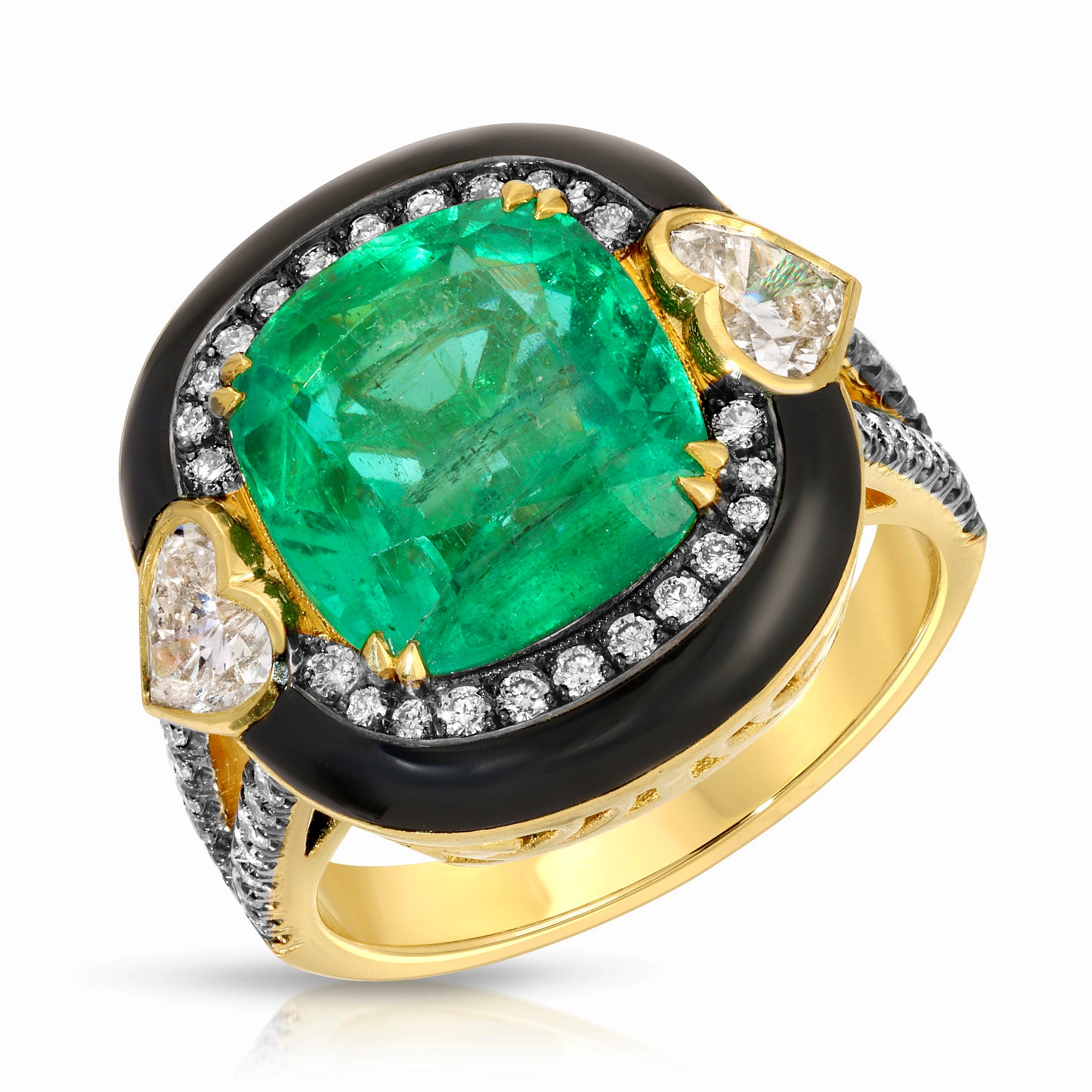 Emerald Queen Ring by Lord Jewelry available at Talisman Collection Fine Jewelers in El Dorado Hills, CA and online. Presenting the Emerald Queen Ring— a majestic masterpiece that commands attention. Gracing the center is a resplendent 5.36 carat emerald, flanked by heart-shaped diamonds totaling .93 cts on either side, encircled by .47 cts of round diamonds. This regal beauty is crowned with a halo of bold black enamel, all elegantly set in 18k gold.