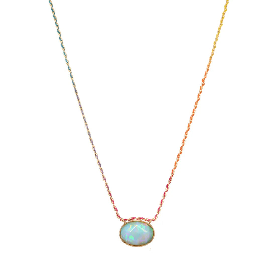 Rose Cut Opal Cool Rainbow Silk by Mined + Found available at Talisman Collection Fine Jewelers in El Dorado Hills, CA and online. This 12.22ct rose-cut opal, with its rainbow play-of-color and soft cushion shape, brings irresistible, sweeter-than-candy vibes. Set in a 14k yellow gold handmade bezel, the opal hangs gracefully from an 18" Rainbow Silk® woven cable chain, secured by a spring ring clasp. It's the perfect necklace to add a pop of brightness to any day.