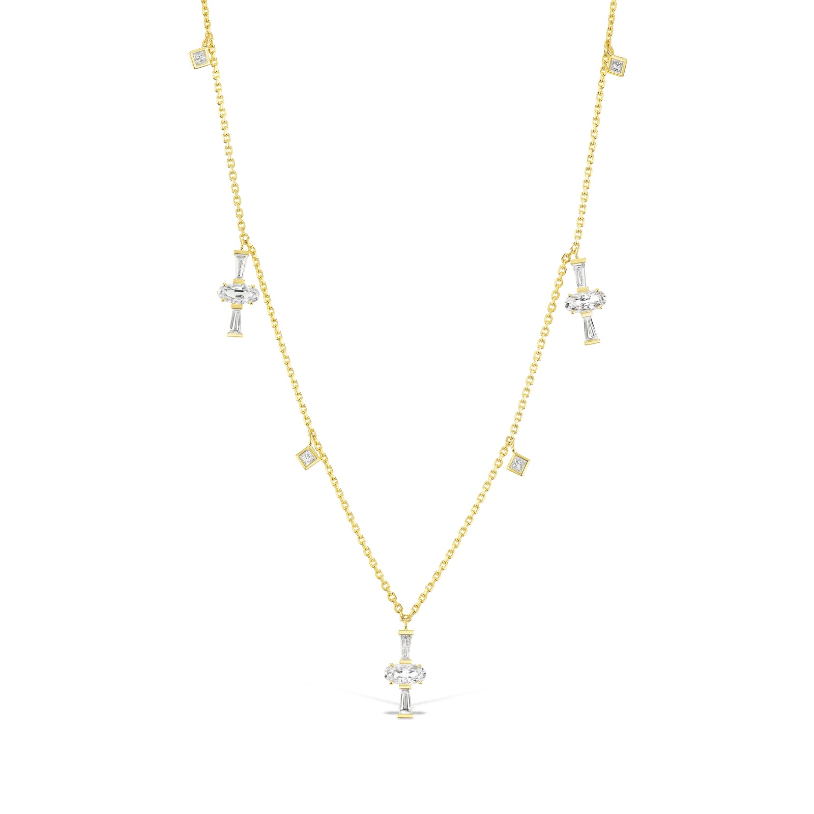 Diamond Sapphire Charm Necklace by Meredith Young, available at Talisman Collection Fine Jewelers in El Dorado Hills, CA and online. This necklace harmoniously merges the beauty of sapphires and diamonds. Adorning it are 1.5 cts of oval-cut sapphires, complemented by 0.58 cts of tapered diamonds, all dangling from a delicate 18k gold chain. The charms dance against your neck imbuing the piece with a touch of flirty style.