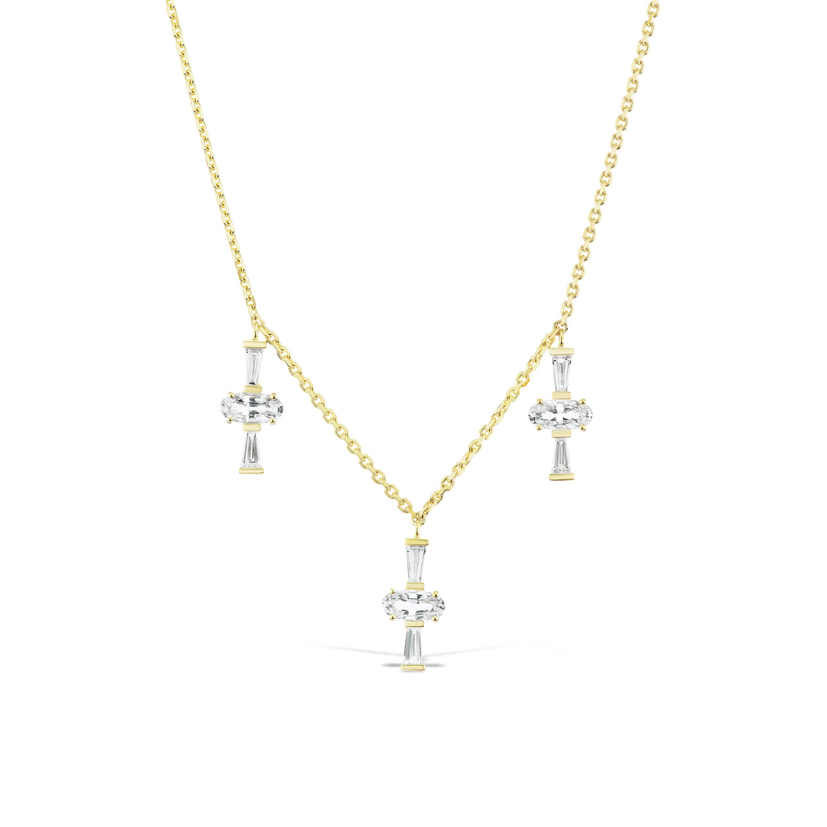 Three Charm Necklace by Meredith Young, available at Talisman Collection Fine Jewelers in El Dorado Hills, CA and online. Three times really is a charm! A delightful trio of oval-cut sapphires, totaling 1.5 carats, accompanied by .41 carats of tapered diamond baguettes dangle from a delicate 18k gold chain. This necklace offers an adjustable length, ranging from 18 to 20 inches, ensuring it's a perfect fit not matter your neckline.