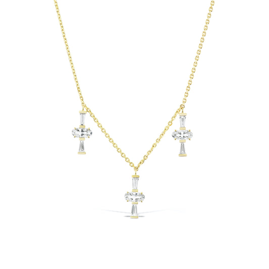 Three Charm Necklace by Meredith Young, available at Talisman Collection Fine Jewelers in El Dorado Hills, CA and online. Three times really is a charm! A delightful trio of oval-cut sapphires, totaling 1.5 carats, accompanied by .41 carats of tapered diamond baguettes dangle from a delicate 18k gold chain. This necklace offers an adjustable length, ranging from 18 to 20 inches, ensuring it's a perfect fit not matter your neckline.