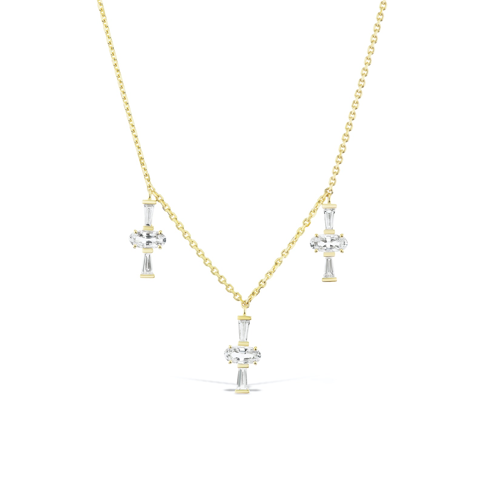 Three Charm Necklace by Meredith Young, available at Talisman Collection Fine Jewelers in El Dorado Hills, CA and online. Three times really is a charm! A delightful trio of oval-cut sapphires, totaling 1.5 carats, accompanied by .41 carats of tapered diamond baguettes dangle from a delicate 18k gold chain. This necklace offers an adjustable length, ranging from 18 to 20 inches, ensuring it's a perfect fit not matter your neckline.