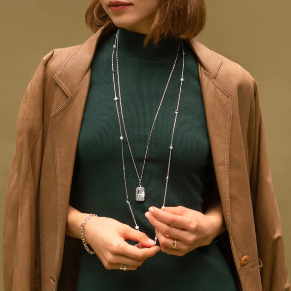 White Sapphire Sun and Star Locket by Monica Rich Kosann