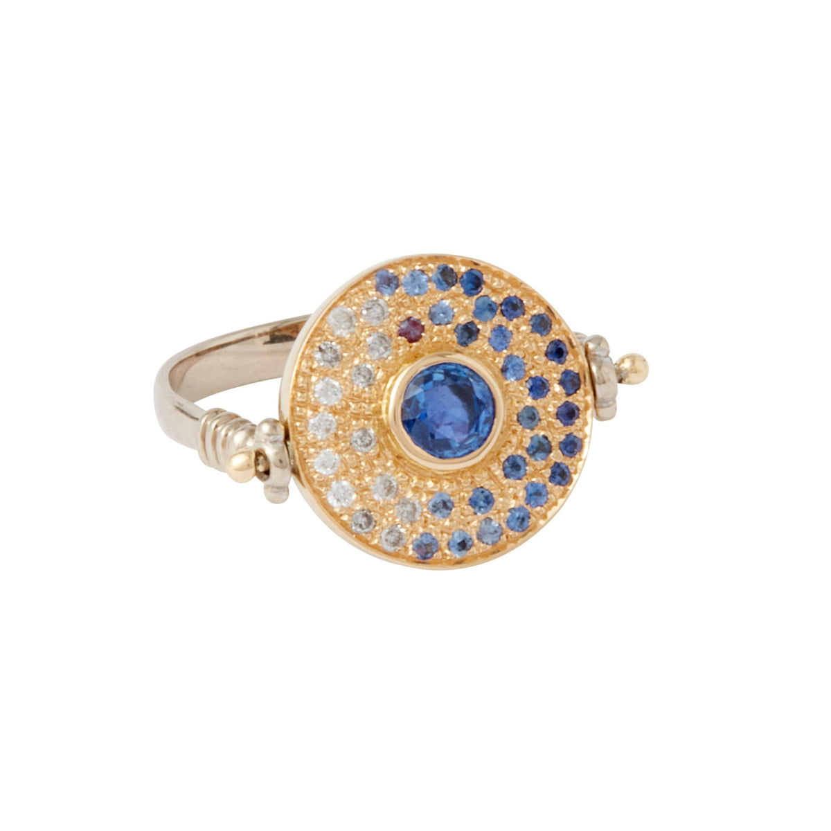 Magi Flip Ring by Unhada available at Talisman Collection Fine Jewelers in El Dorado Hills, CA and online. Be enchanted by this unique Magi Flip Ring created with ombre blue sapphires (.45 cts), fancy sapphires (.17 cts), diamonds (.10 cts) set in 18k gold on a sterling silver band. The ring magically flips to reveal a hidden purple pear-cut sapphire (.24 cts) and a secret message saying, "magic all around."