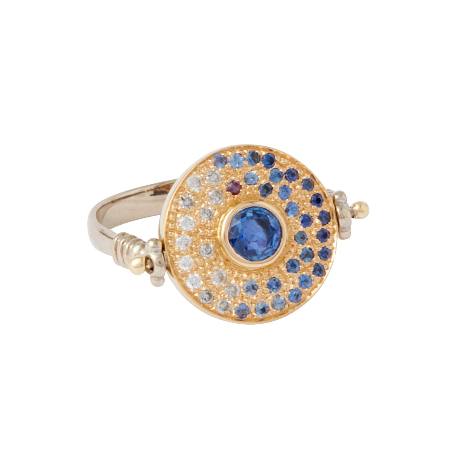 Magi Flip Ring by Unhada available at Talisman Collection Fine Jewelers in El Dorado Hills, CA and online. Be enchanted by this unique Magi Flip Ring created with ombre blue sapphires (.45 cts), fancy sapphires (.17 cts), diamonds (.10 cts) set in 18k gold on a sterling silver band. The ring magically flips to reveal a hidden purple pear-cut sapphire (.24 cts) and a secret message saying, "magic all around."
