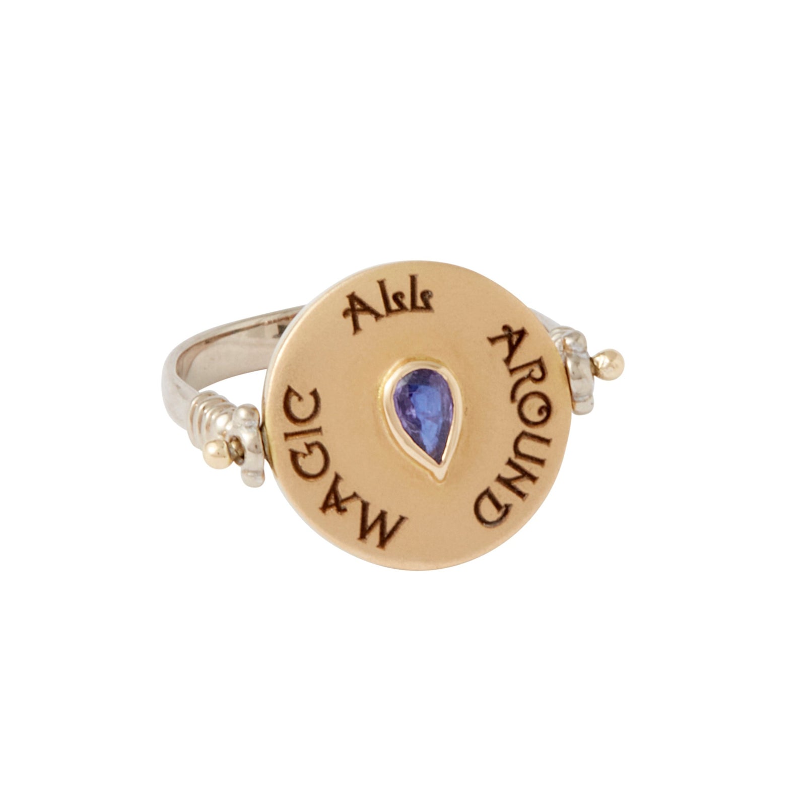 Magi Flip Ring by Unhada available at Talisman Collection Fine Jewelers in El Dorado Hills, CA and online. Be enchanted by this unique Magi Flip Ring created with ombre blue sapphires (.45 cts), fancy sapphires (.17 cts), diamonds (.10 cts) set in 18k gold on a sterling silver band. The ring magically flips to reveal a hidden purple pear-cut sapphire (.24 cts) and a secret message saying, "magic all around."