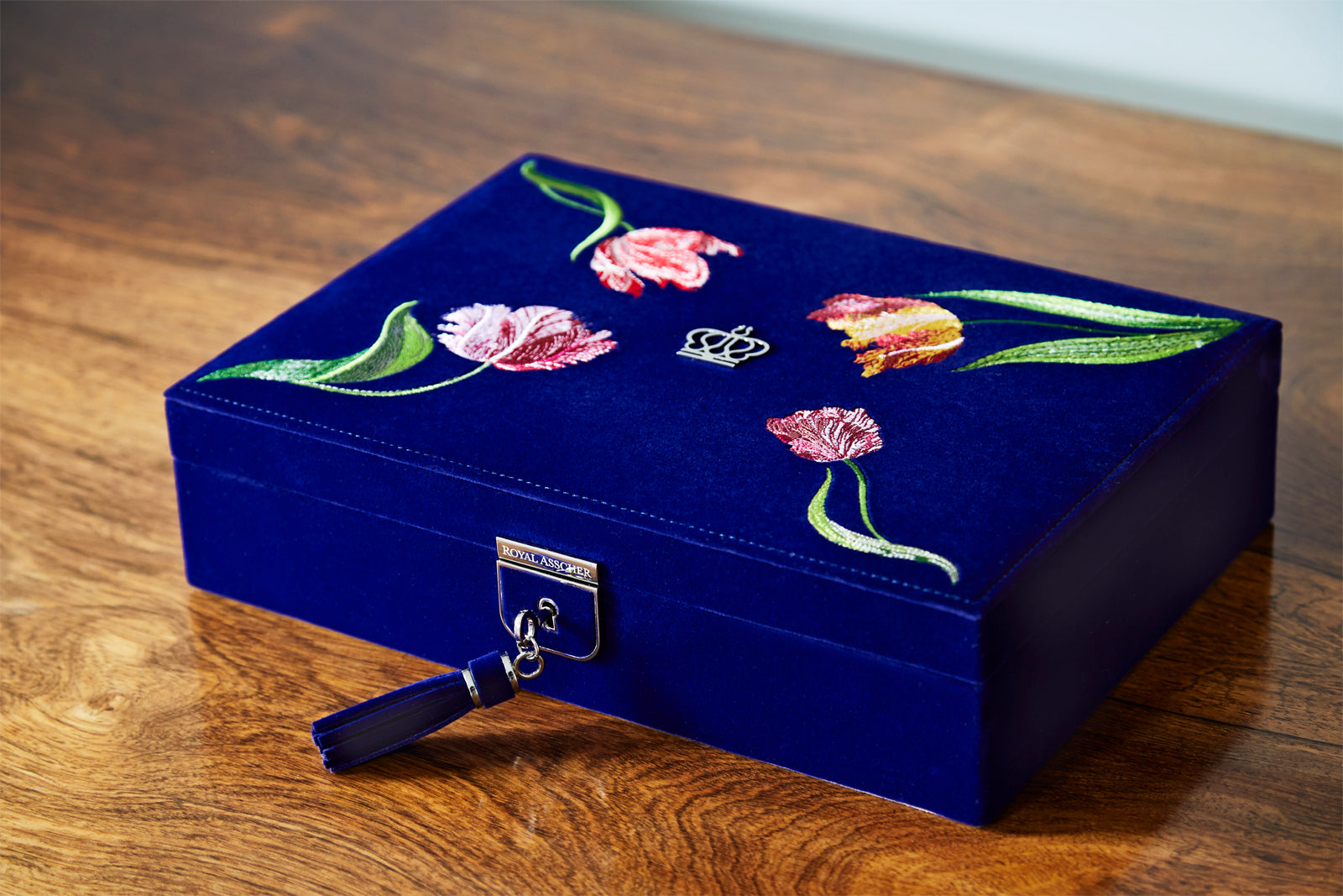 Royal Asscher Royal Asscher Medium Jewelry Box by Wolf available at Talisman Collection Fine Jewelers in El Dorado Hills, CA and online. The Medium Jewellery Box features deep blue velvet exterior with elaborate tulip embroidery inside and out, the medium jewellery box with removable travel case, displays and organises your jewellery in style. Includes LusterLoc™ anti-tarnish lining and lock & key with silver finish.