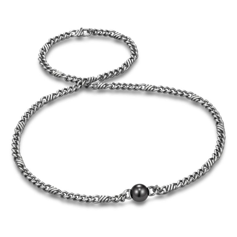 Sorrento Link & Chain Tahitian Pearl Men's Necklace by Mastoloni Pearls available at Talisman Collection Fine Jewelers in El Dorado Hills, CA and online.  This necklace features a stunning 11-12 mm Tahitian pearl, making it the perfect statement piece for anyone. Crafted with high-quality sterling silver, this necklace offers both durability and elegance. With a 22" length, it sits comfortably on the neck, adding a touch of edge. 