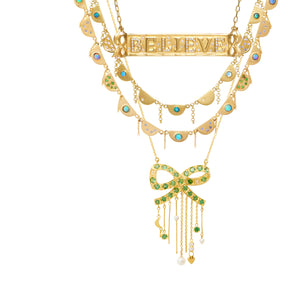 Tsavorite Chantal Necklace by Unhada available at Talisman Collection Fine Jewelers in El Dorado Hills, CA and online.The Chantal necklace brings a touch of je ne sais quoi to your daily ensemble. The intricate scalloped design exudes elegance and grace; it's gorgeous on its own, and even more stunning when combined with other necklaces! This 18k gold piece features dazzling Tsavorite (.09 cts), opals, and sapphires (.10 cts). 